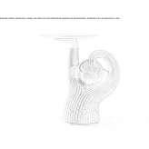 A low, round, concrete coffee table Claira