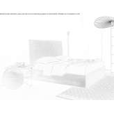 A bed with a high headboard Bedwas